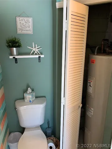 a view of a room with a ceiling fan