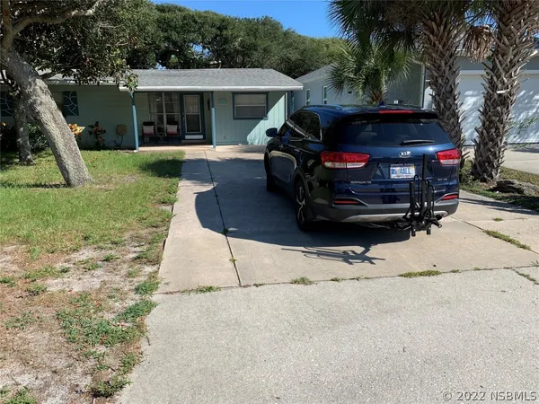 a view of a backyard with furniture