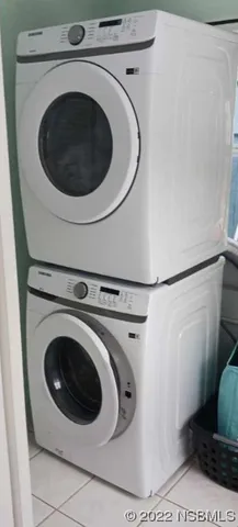 a view of a house with backyard porch and sitting area