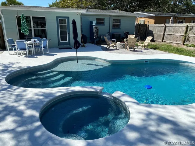 a patio with patio a couch and chairs