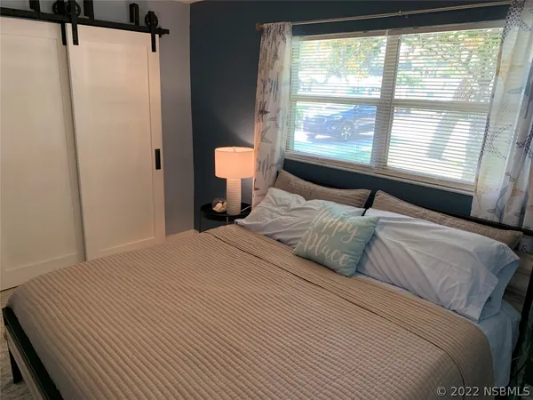 kids bathroom with a painting on the wall