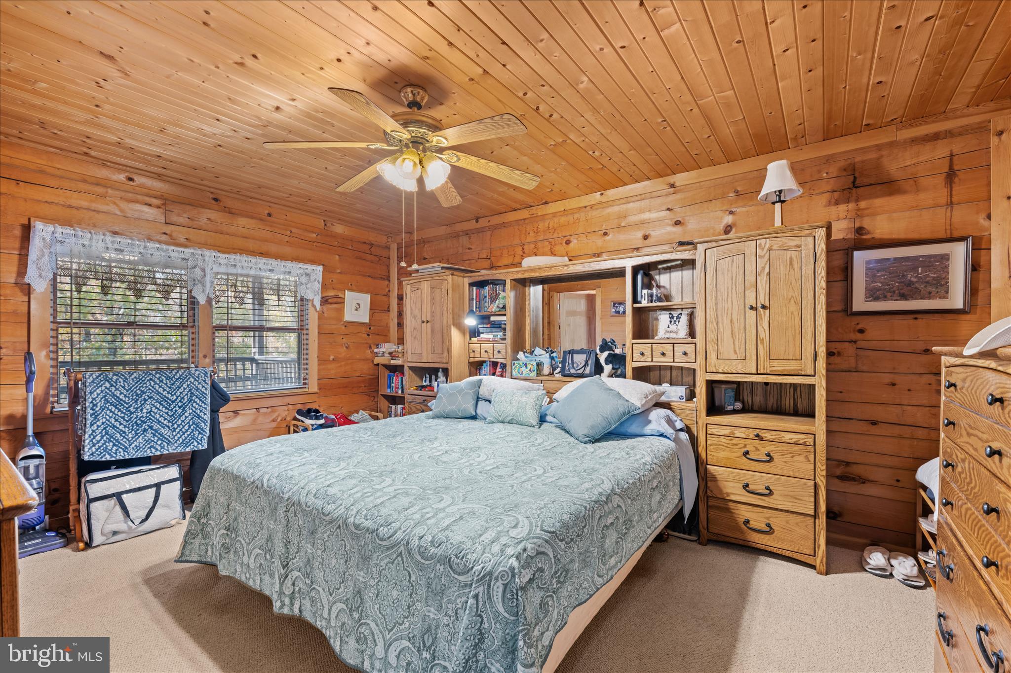 4176 Timber Ridge Road Berkeley Springs, WV 25411 - Photo 17 of 61 a bedroom with a bed and wooden floor