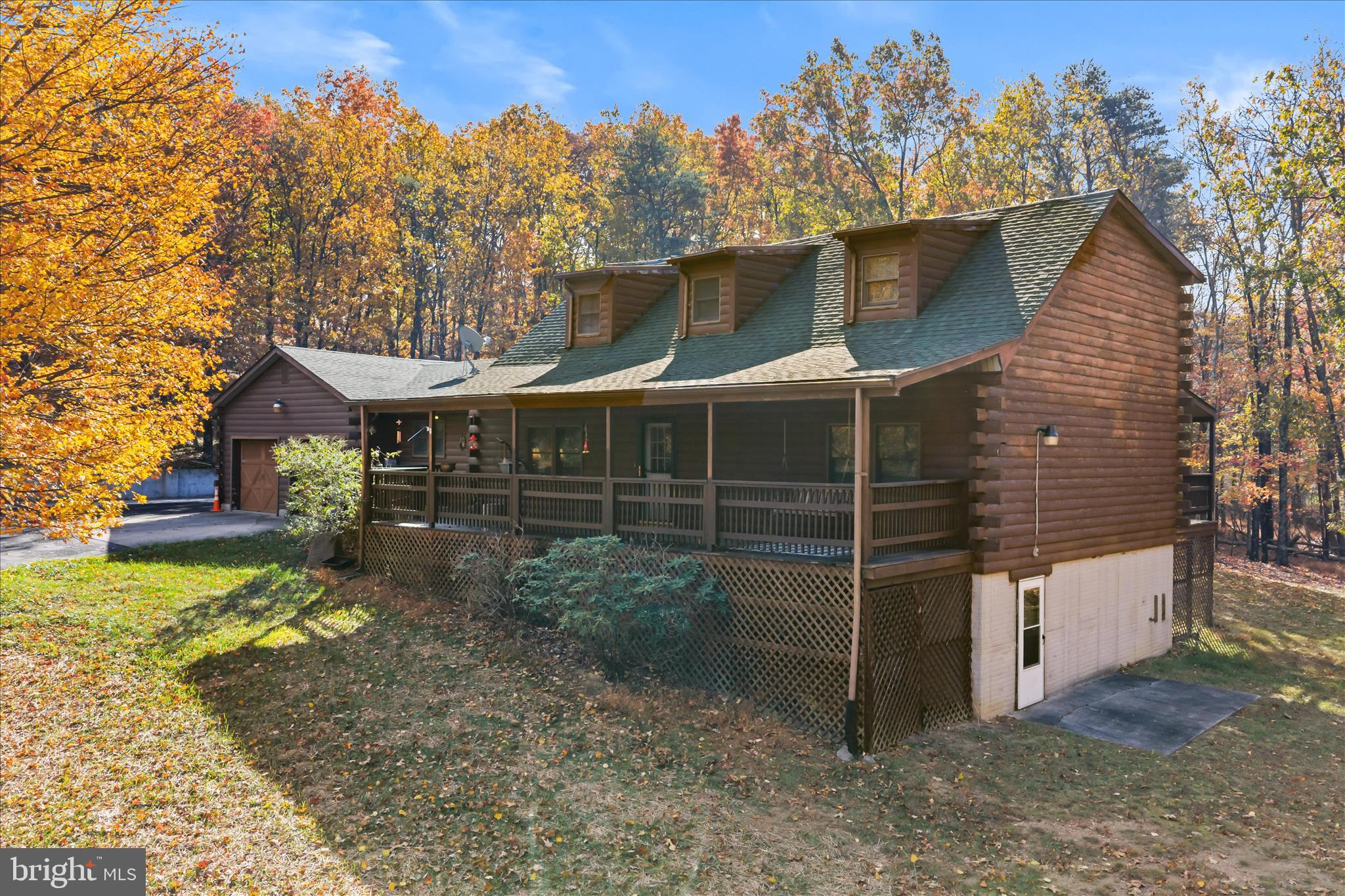4176 Timber Ridge Road Berkeley Springs, WV 25411 - Photo 3 of 61 a view of a house with a yard