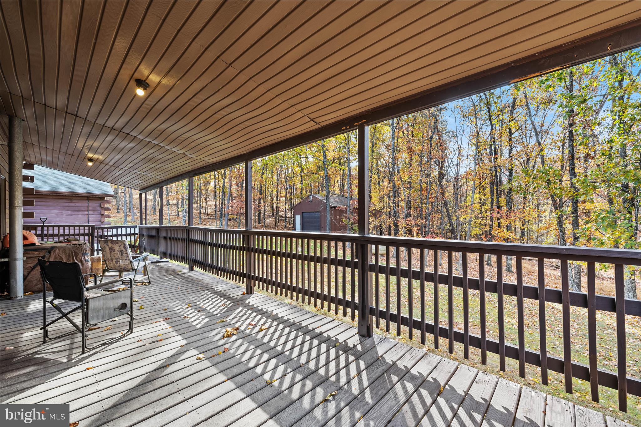 4176 Timber Ridge Road Berkeley Springs, WV 25411 - Photo 39 of 61 a view of a porch with furniture and a backyard