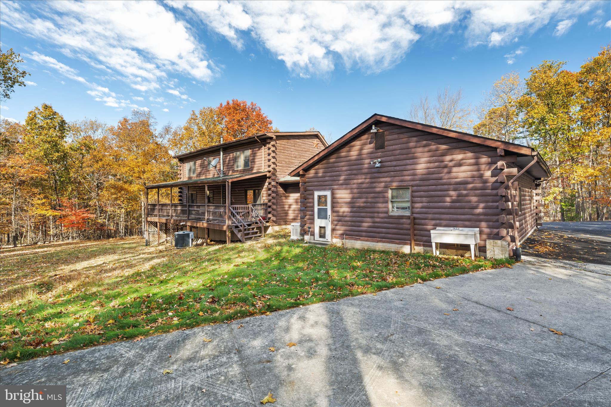 4176 Timber Ridge Road Berkeley Springs, WV 25411 - Photo 40 of 61 a front view of a house with a yard and garage