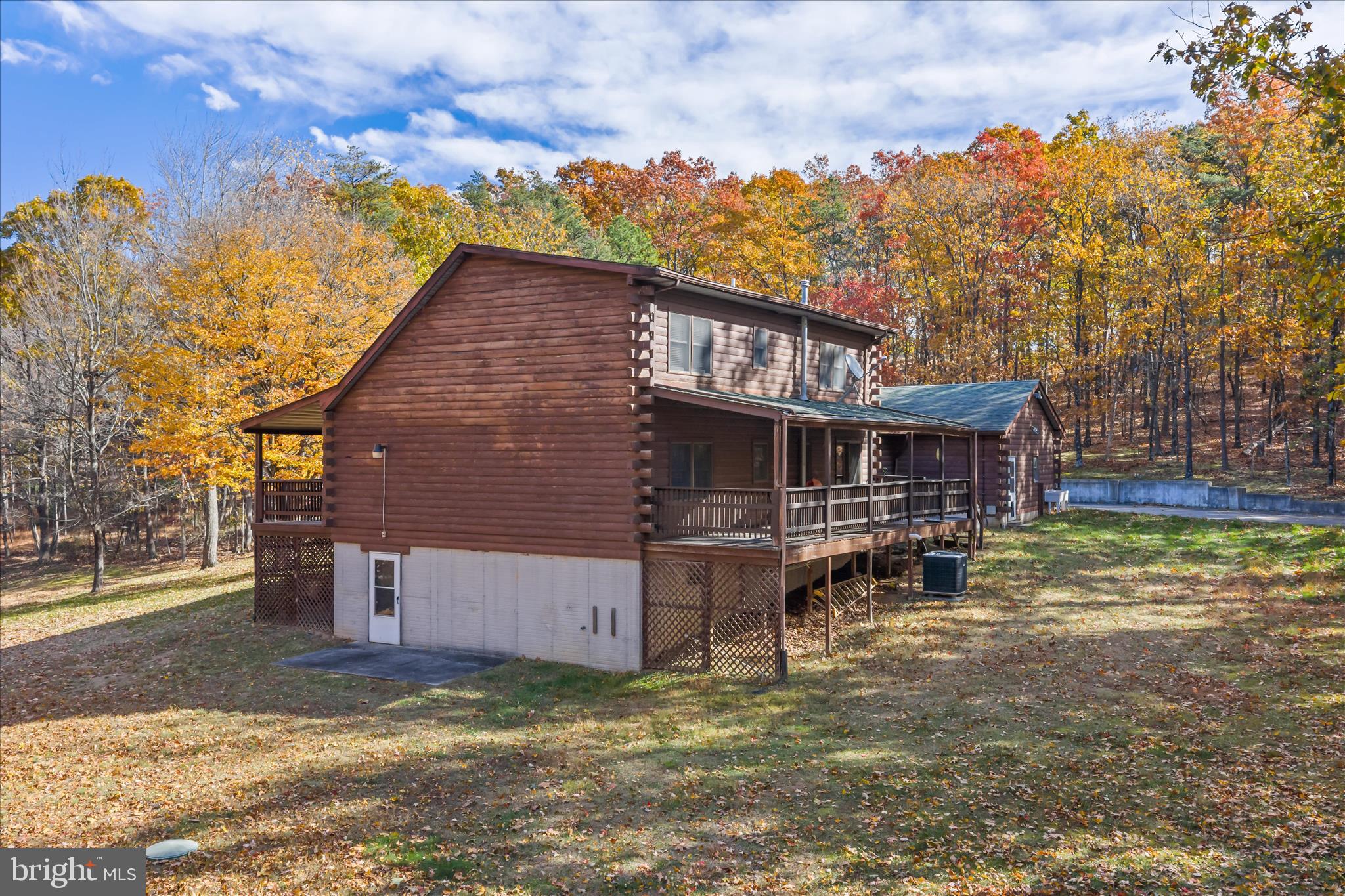 4176 Timber Ridge Road Berkeley Springs, WV 25411 - Photo 44 of 61 a backyard of a house with table and chairs