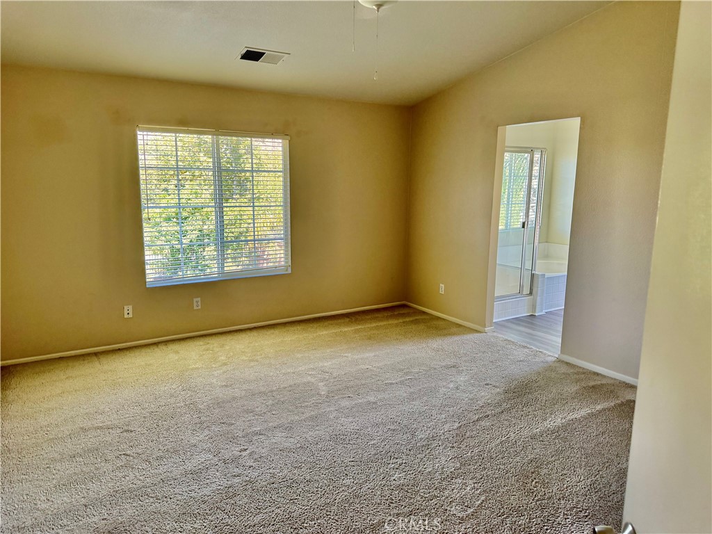 32040 Poppy Way Lake Elsinore, CA 92532 - Photo 11 of 27 an empty room with a empty space and windows