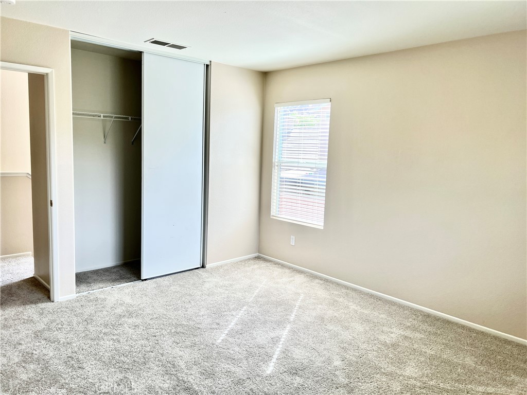 32040 Poppy Way Lake Elsinore, CA 92532 - Photo 16 of 27 a view of an empty room with a window