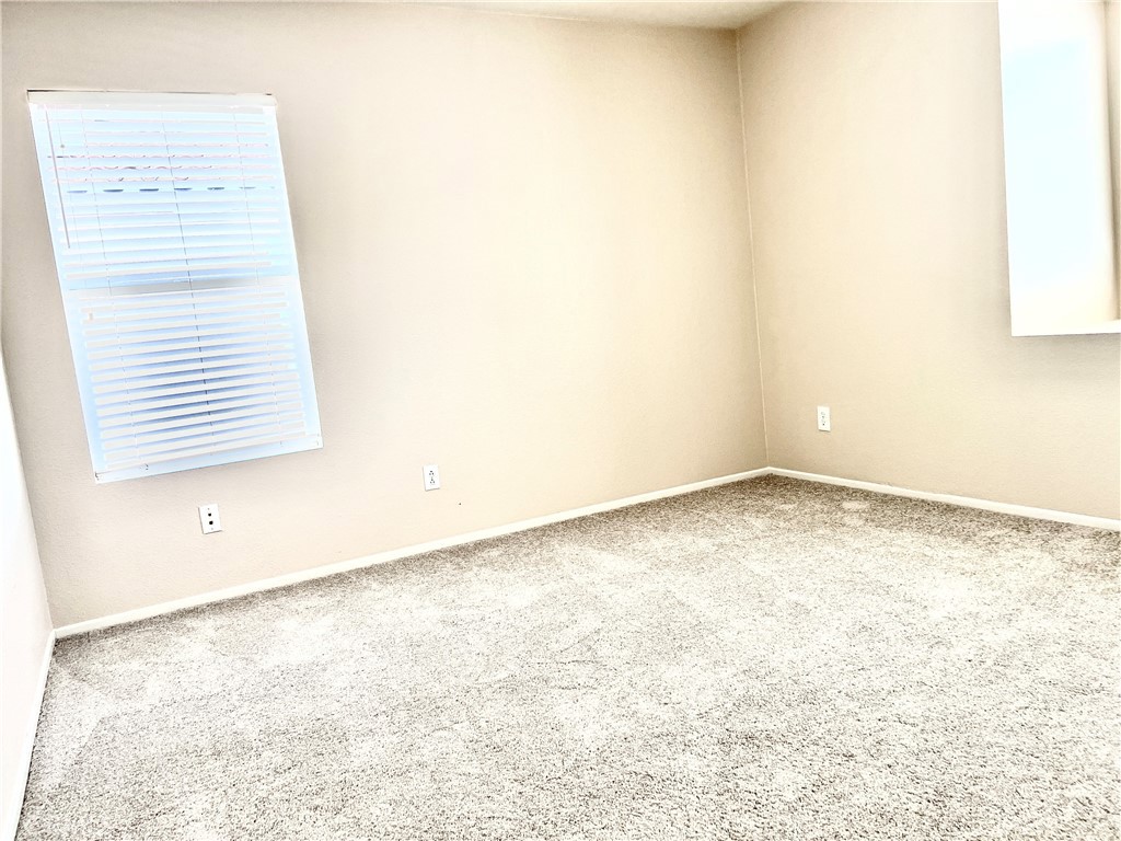 32040 Poppy Way Lake Elsinore, CA 92532 - Photo 19 of 27 an empty room with a workbench
