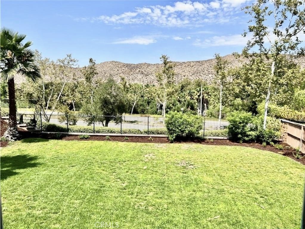 32040 Poppy Way Lake Elsinore, CA 92532 - Photo 21 of 27 a view of a garden with houses