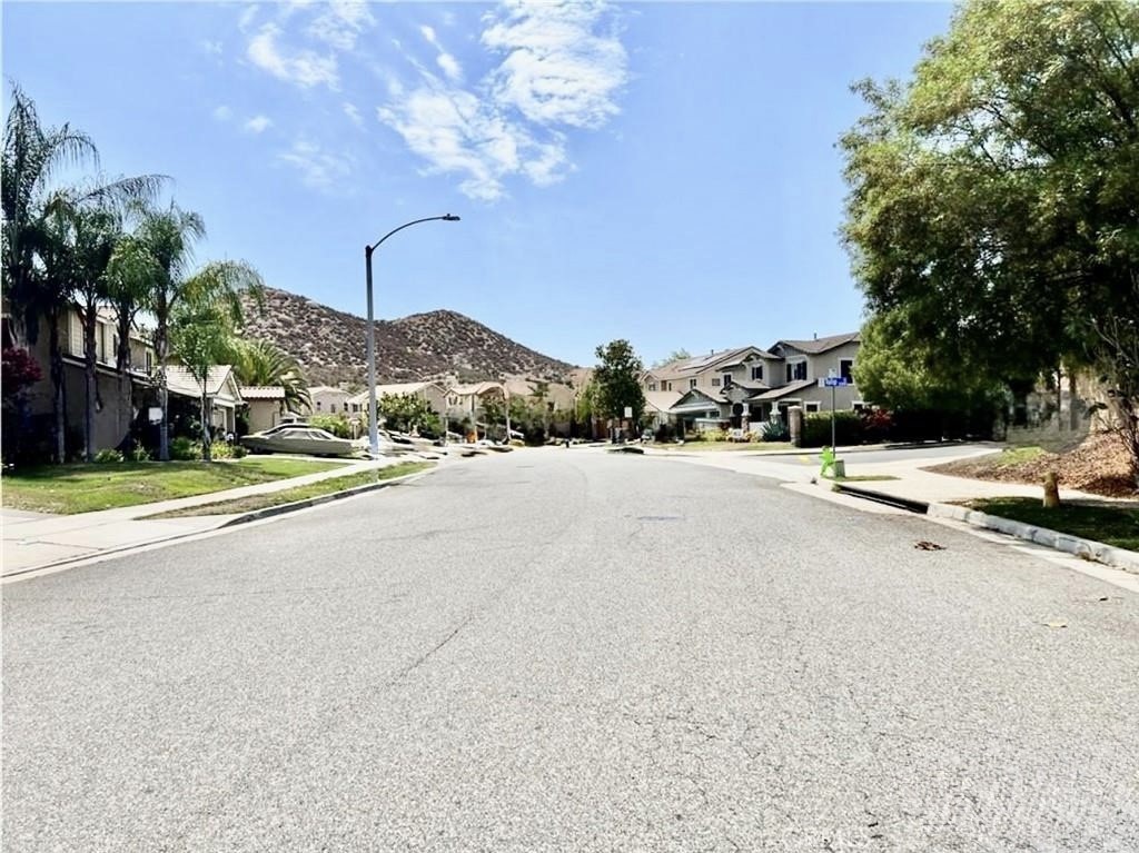32040 Poppy Way Lake Elsinore, CA 92532 - Photo 25 of 27 a view of a road with a building in the background