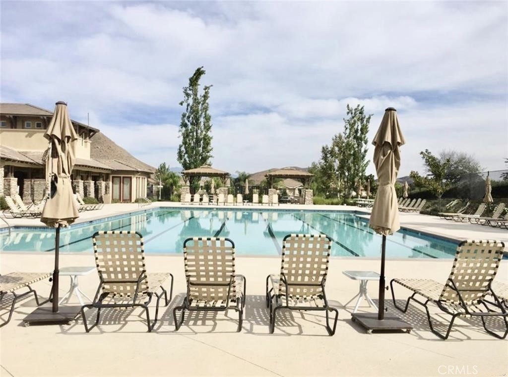32040 Poppy Way Lake Elsinore, CA 92532 - Photo 26 of 27 a view of lake from balcony with outdoor seating