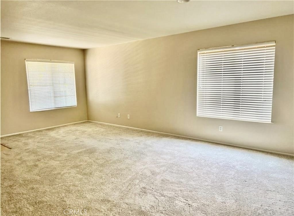 32040 Poppy Way Lake Elsinore, CA 92532 - Photo 4 of 27 an empty room with a window