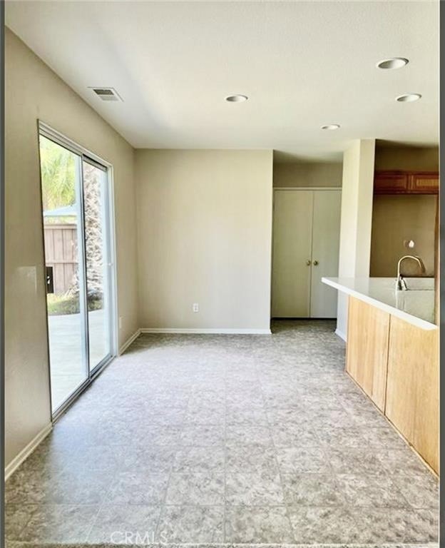 32040 Poppy Way Lake Elsinore, CA 92532 - Photo 7 of 27 a view of a kitchen with a sink and a large window