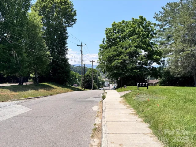 a view of swimming pool with a yard
