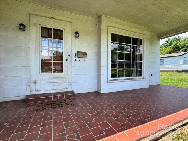 a view of a brick house with a window