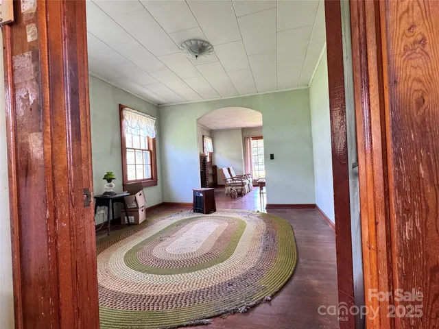an entryway and livingroom with furniture