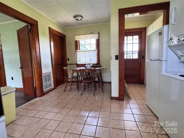 a bedroom with a bed and a mirror