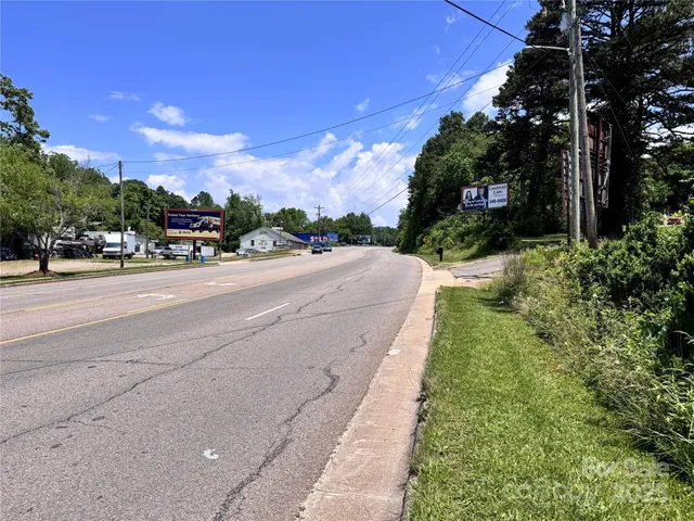 a view of a street with a building in the background
