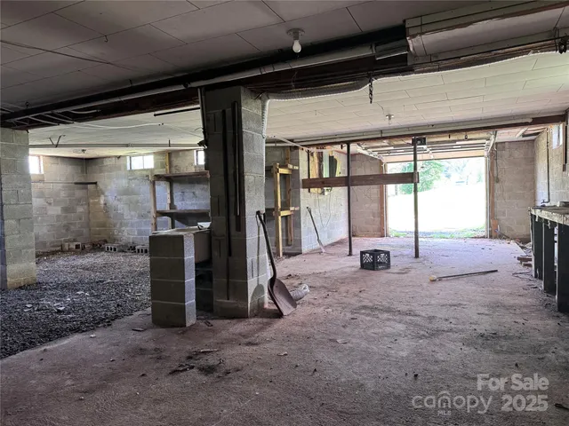 a view of a livingroom with furniture and a fireplace