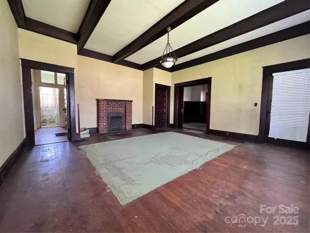 a view of empty room with windows