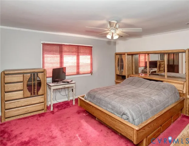 a bed room with a bed and a television