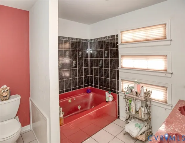 a bathroom with a bathtub sink and toilet
