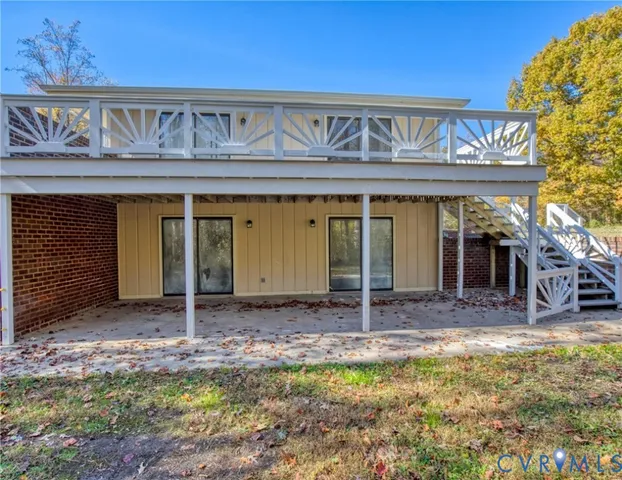a front view of a house with a garden and yard
