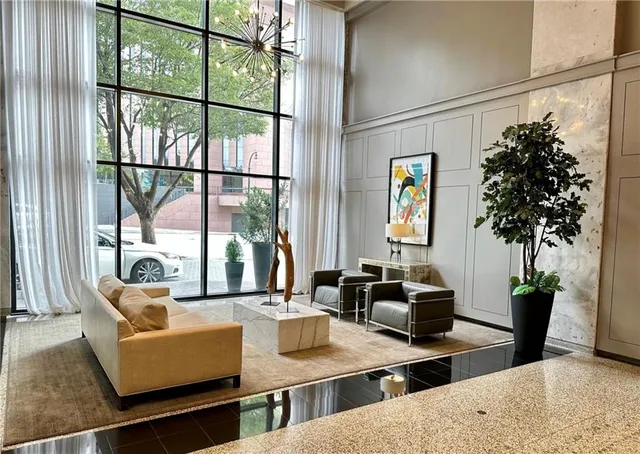 a living room with furniture and a large window