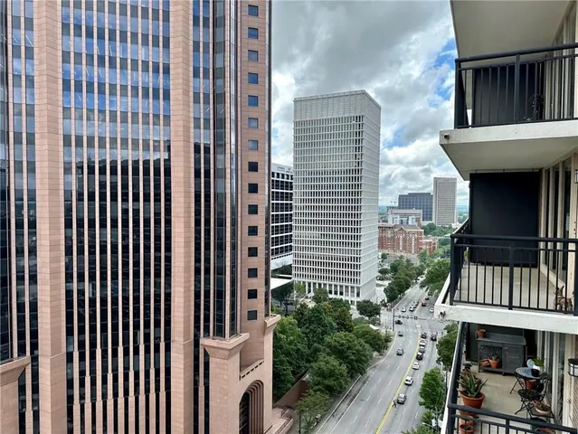 a kitchen with a stove a refrigerator and a more cabinets