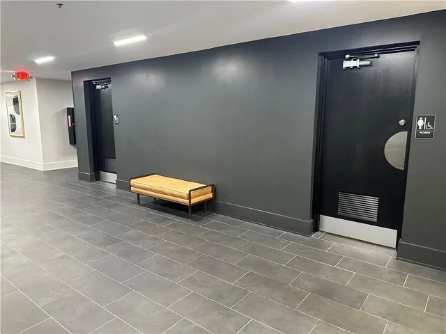 a view of a livingroom with furniture and window