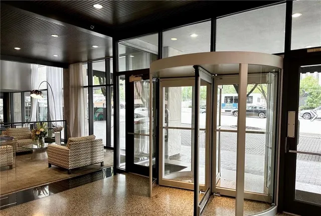 a living room with furniture and a large window