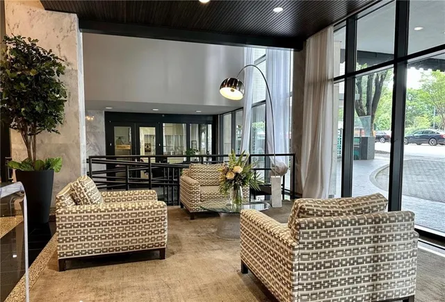a room with a table chairs and wooden floor