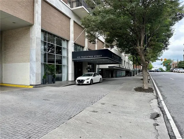 a view of street with parked cars