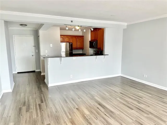 a kitchen with stainless steel appliances granite countertop a stove and a microwave