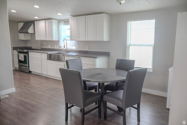 8522 Solar Way, Unit 8522 Sandy, UT 84070 - Photo 2 of 6 Kitchen and Dining room with dark wood-style flooring and recessed lighting