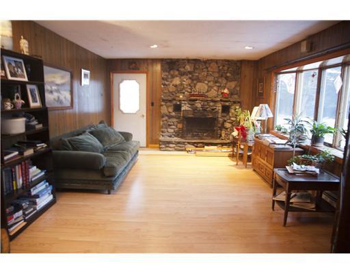 243 Bobcat Road Clifton, ME 04428 - Photo 17 of 25 Living Room. Wood burning fireplace...