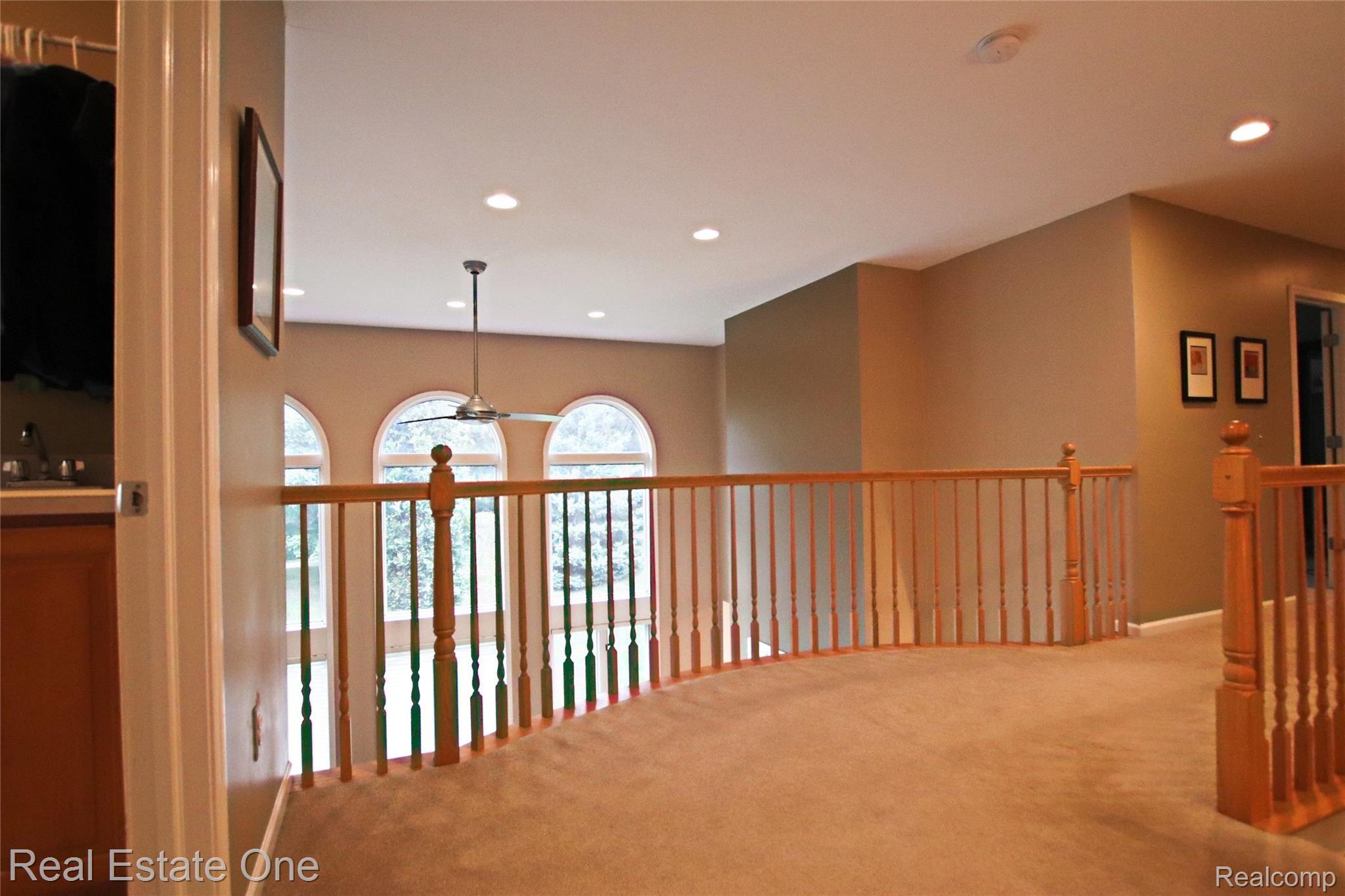1272 Welland Drive Rochester, MI 48306 - Photo 24 of 53 Bridge/staircase overlooking the great room with amazing outside views