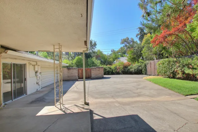 a view of a backyard with sitting area