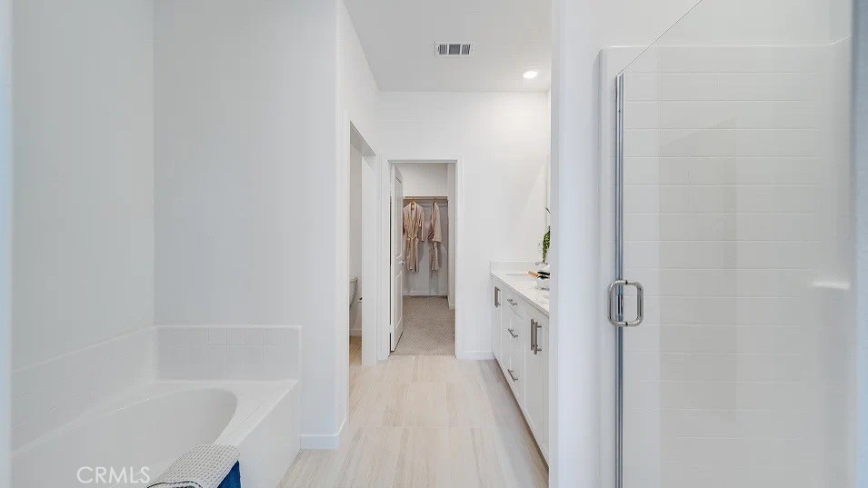 8475 Gabrielino Court Rancho Cucamonga, CA 91730 - Photo 13 of 19 a bathroom with a bathtub and a shower