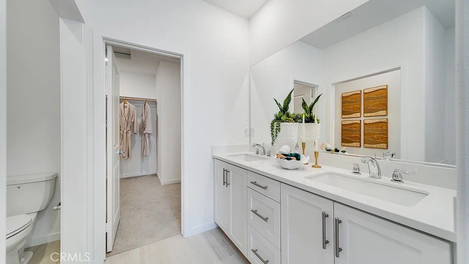 8475 Gabrielino Court Rancho Cucamonga, CA 91730 - Photo 14 of 19 a bathroom with a sink double vanity and a mirror