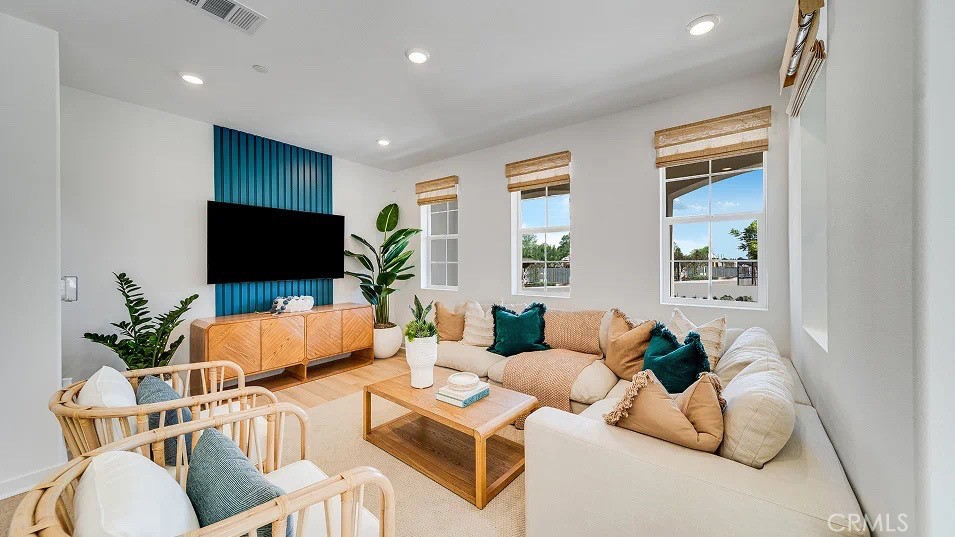 8475 Gabrielino Court Rancho Cucamonga, CA 91730 - Photo 6 of 19 a living room with furniture and a flat screen tv