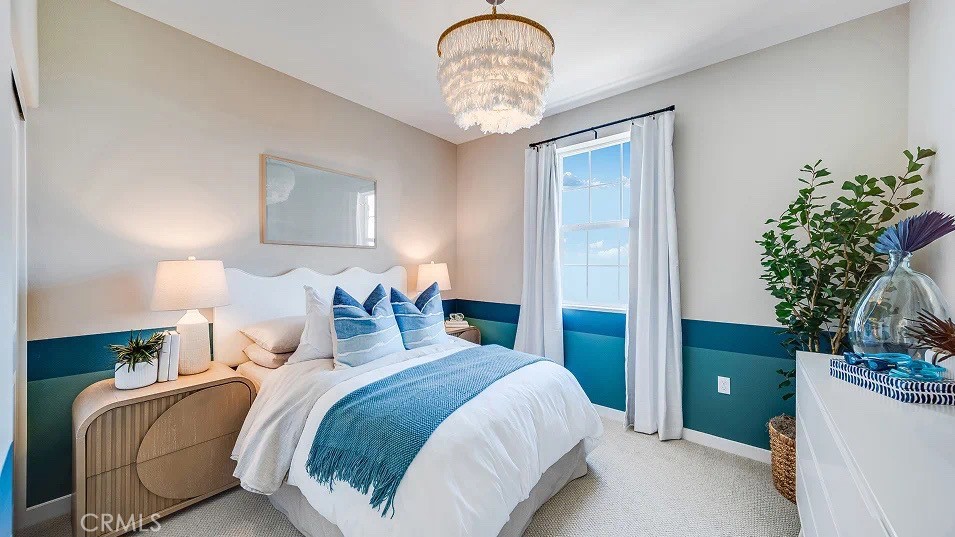 8475 Gabrielino Court Rancho Cucamonga, CA 91730 - Photo 7 of 19 a bedroom with a bed and a chandelier