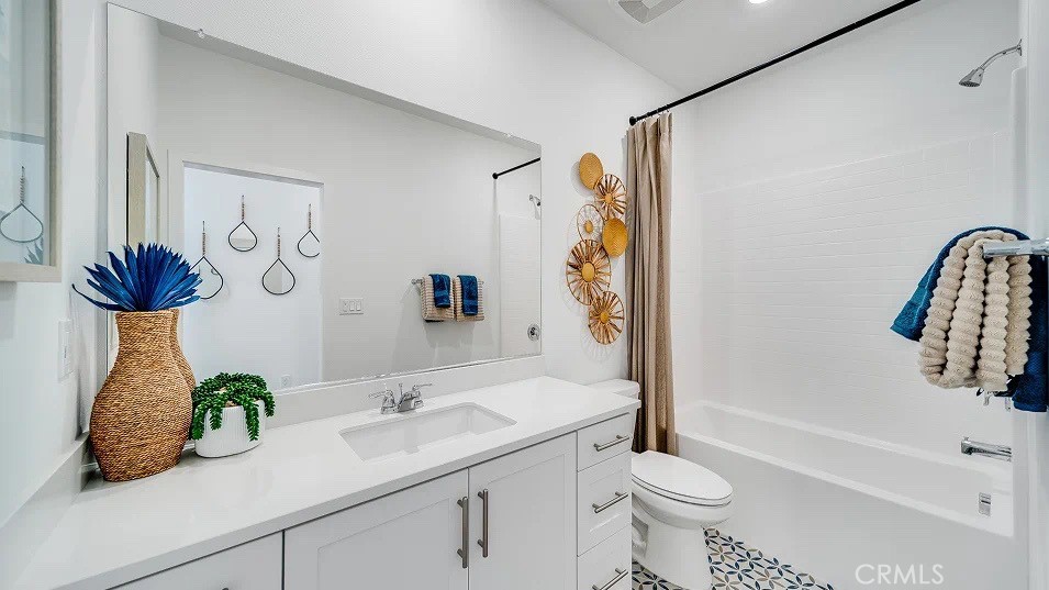 8475 Gabrielino Court Rancho Cucamonga, CA 91730 - Photo 8 of 19 a bathroom with a sink a toilet and shower