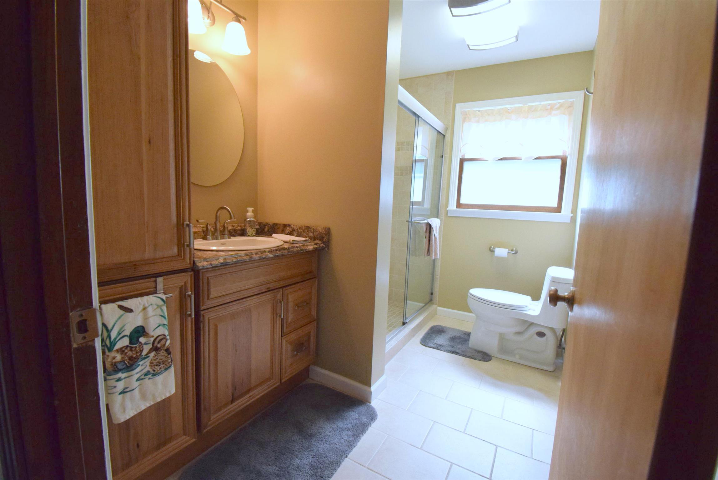 2242 Cedar Grove Road Lebanon, TN 37087 - Photo 11 of 21 a bathroom with a sink a toilet and mirror