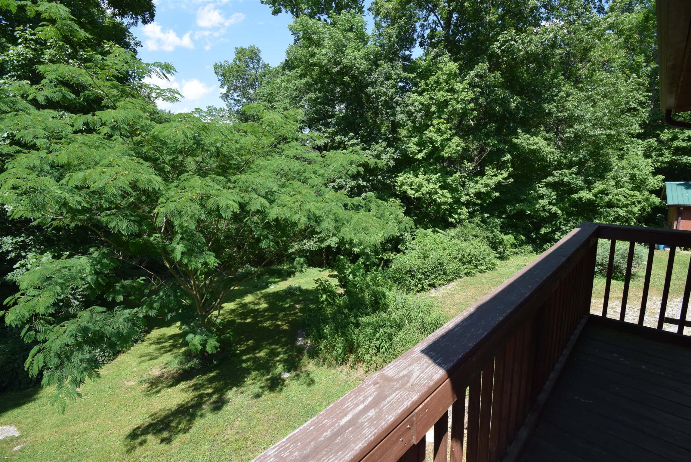 2242 Cedar Grove Road Lebanon, TN 37087 - Photo 15 of 21 a balcony with wooden floor and yard in the back