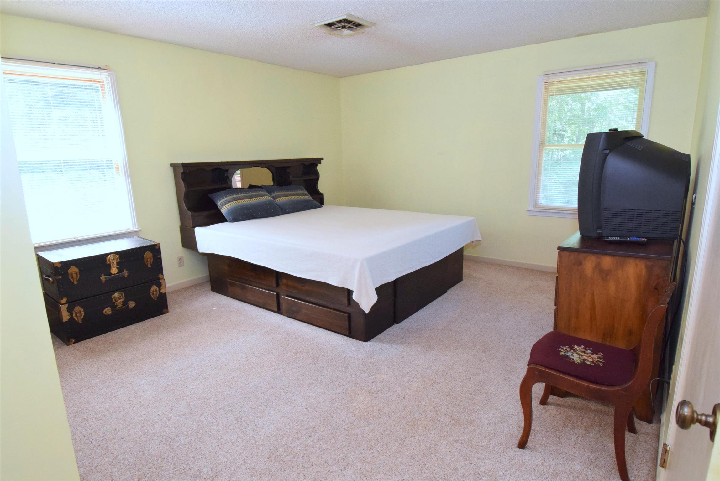 2242 Cedar Grove Road Lebanon, TN 37087 - Photo 16 of 21 a bedroom with a bed and a chair