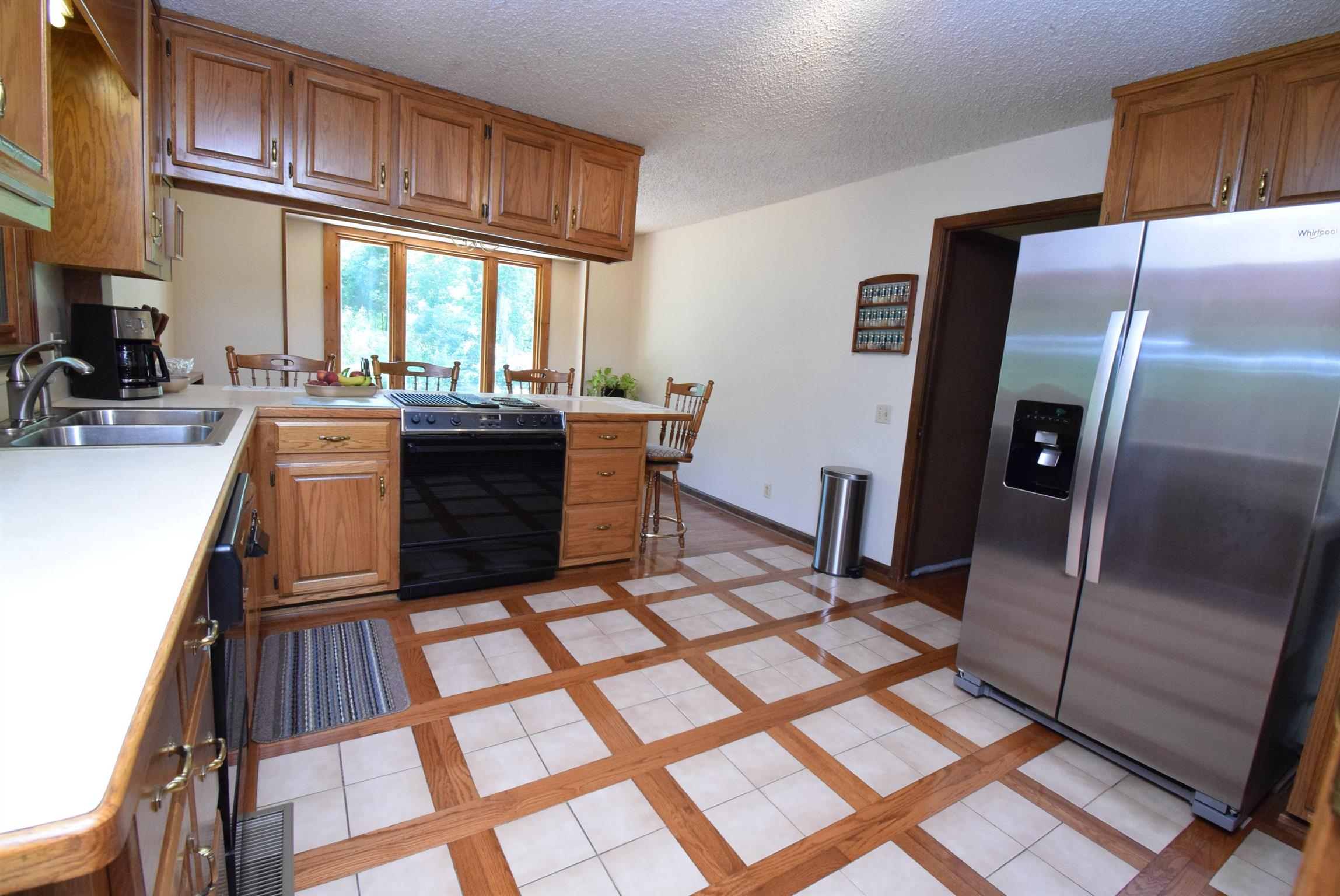 2242 Cedar Grove Road Lebanon, TN 37087 - Photo 4 of 21 a kitchen with stainless steel appliances granite countertop a refrigerator stove and sink