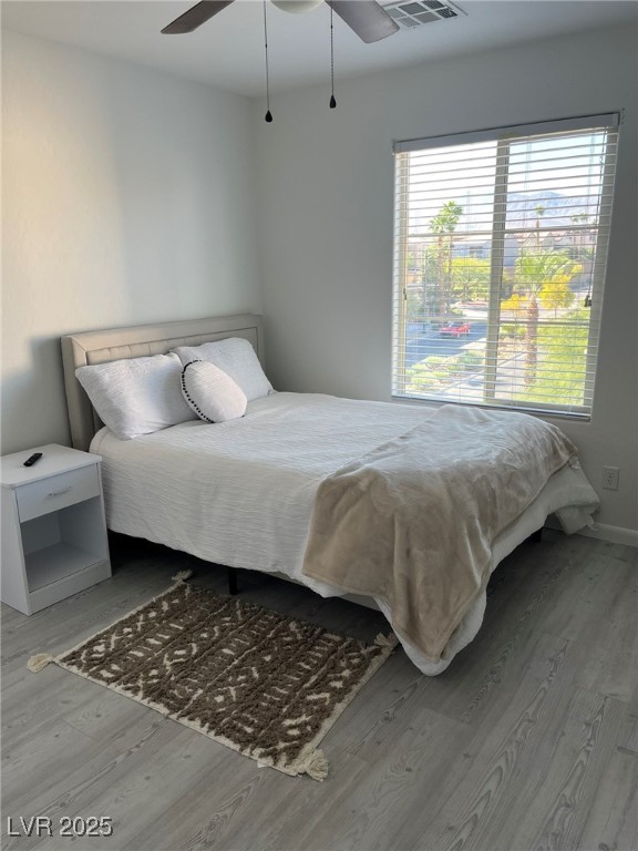 7600 Finishing Touch Court Las Vegas, NV 89149 - Photo 21 of 32 Bedroom with wood finished floors and a ceiling fan