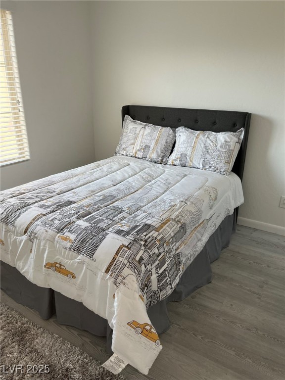 7600 Finishing Touch Court Las Vegas, NV 89149 - Photo 23 of 32 Bedroom with wood finished floors and baseboards